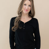 Woman wearing Women's Long Sleeve Henley Tee in Midnight and jeans
