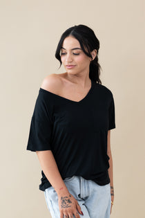 Female wearing the Women’s Relaxed Fit V-Neck in Midnight off the shoulder  ::: Model is 5'5" wearing size S ///