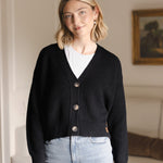 Woman soft smiling wearing a cropped cardigan in midnight with jeans.
::: Model is 5'9" wearing size S ///