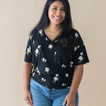 Female model wearing the Women’s Relaxed Fit V-Neck in Big Midnight Magnolia