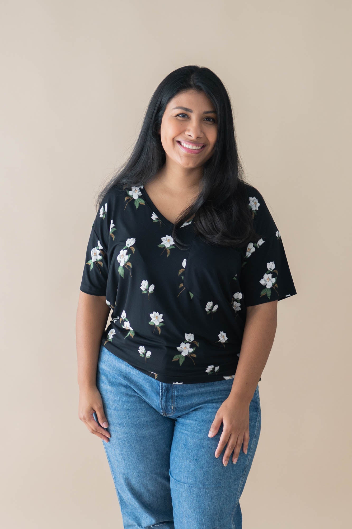 Female model wearing the Women’s Relaxed Fit V-Neck in Big Midnight Magnolia