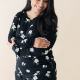 Model wearing Kyte Baby Women's Jogger Pajama Set in Big Midnight Magnolia