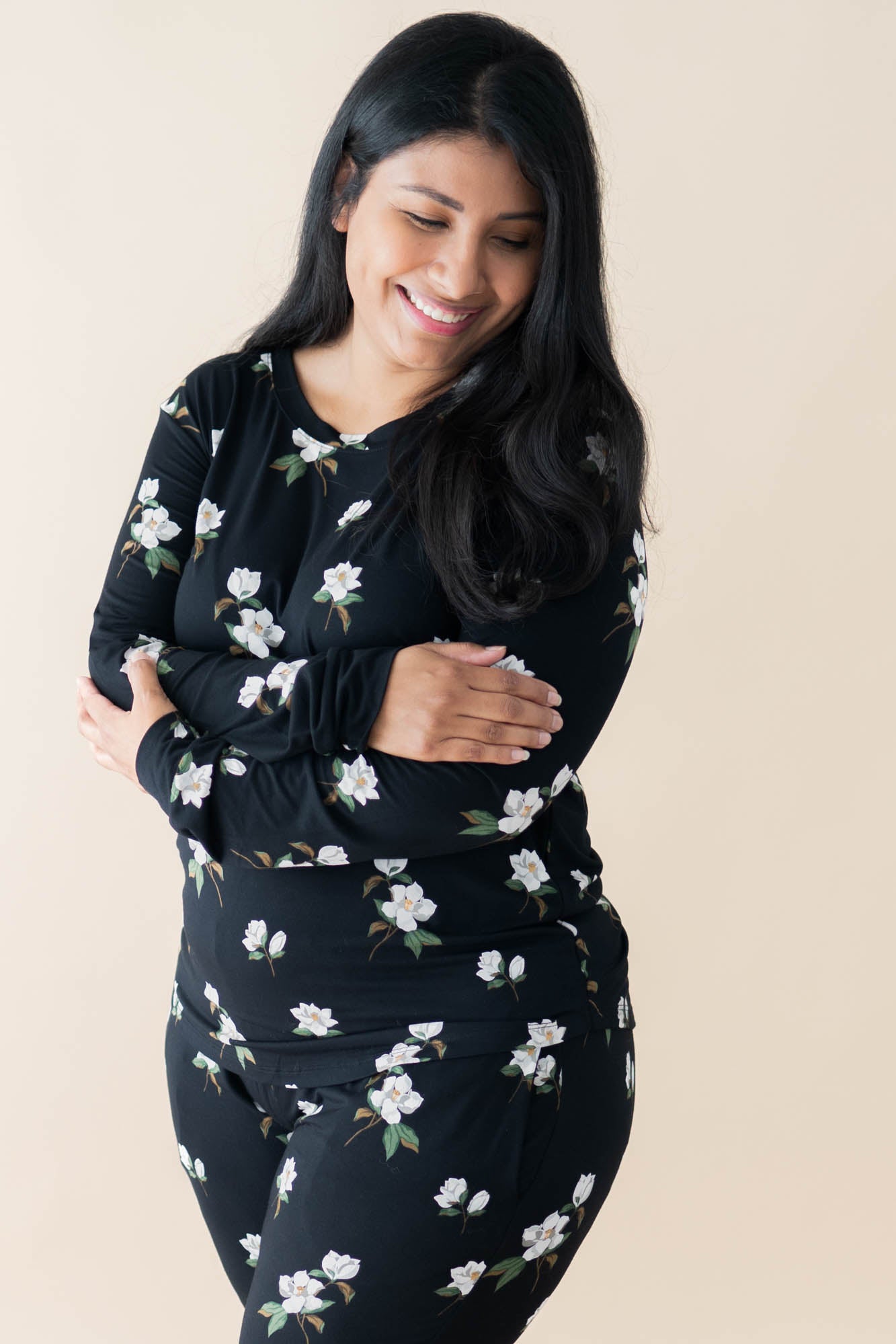 Model wearing Kyte Baby Women's Jogger Pajama Set in Big Midnight Magnolia