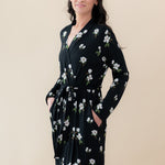 Smiling model wearing the Women’s Lounge Robe in Big Midnight Magnolia