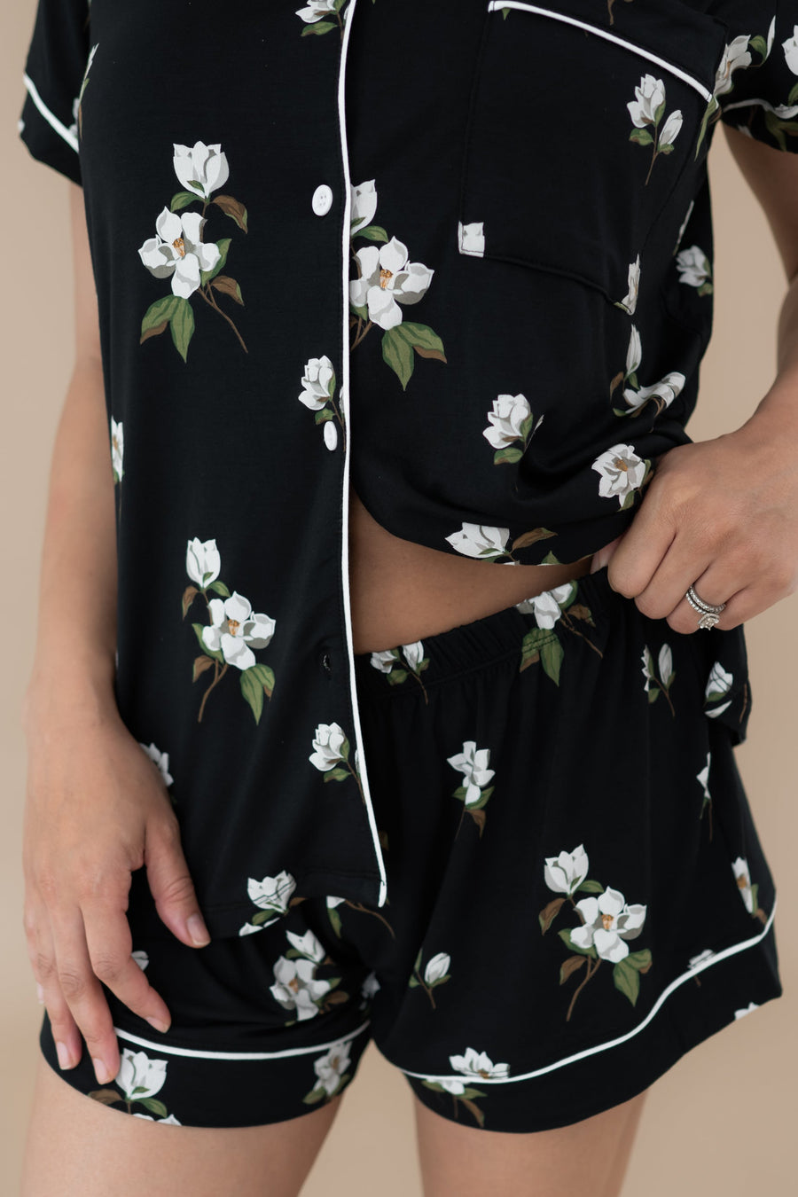Woman wearing black bamboo Short Sleeve Pajamas in Big Midnight Magnolia