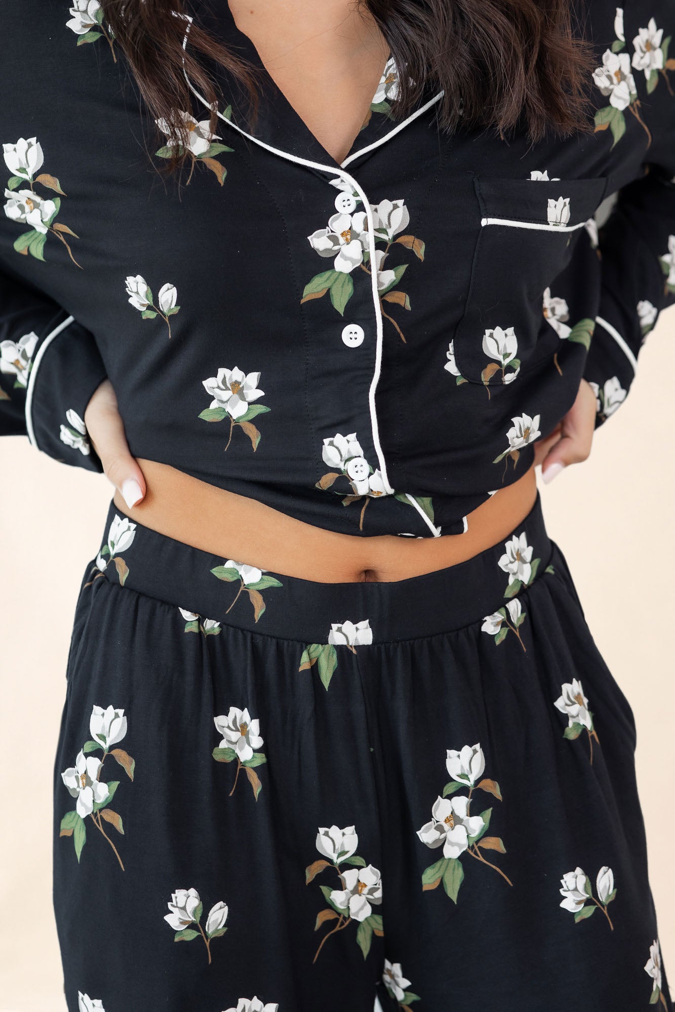 Black floral dress with a close-up of the outfit on a neutral background