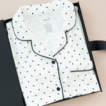 Women's Short Sleeve Pajama Set in Midnight Polka Dot print packed in a box on a beige background