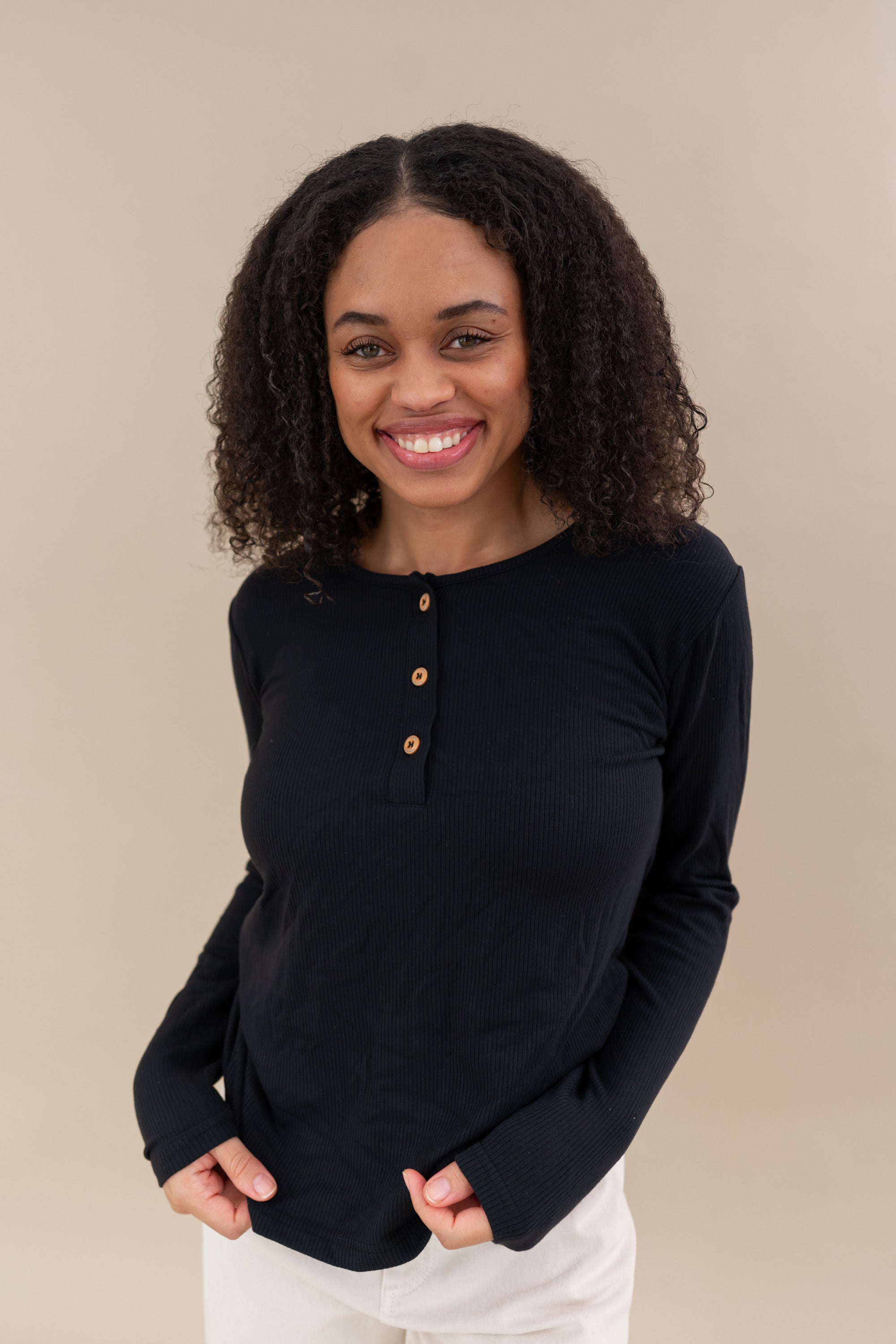 Model wearing the Women's Ribbed Henley Top in Midnight