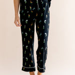 Model show casing the cropped pajama of Women's Short Sleeve Cropped Pajama Set in Midnight Wildflower print on a beige background ---1620 3