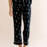 Model show casing the cropped pajama of Women's Short Sleeve Cropped Pajama Set in Midnight Wildflower print on a beige background ---1620 3