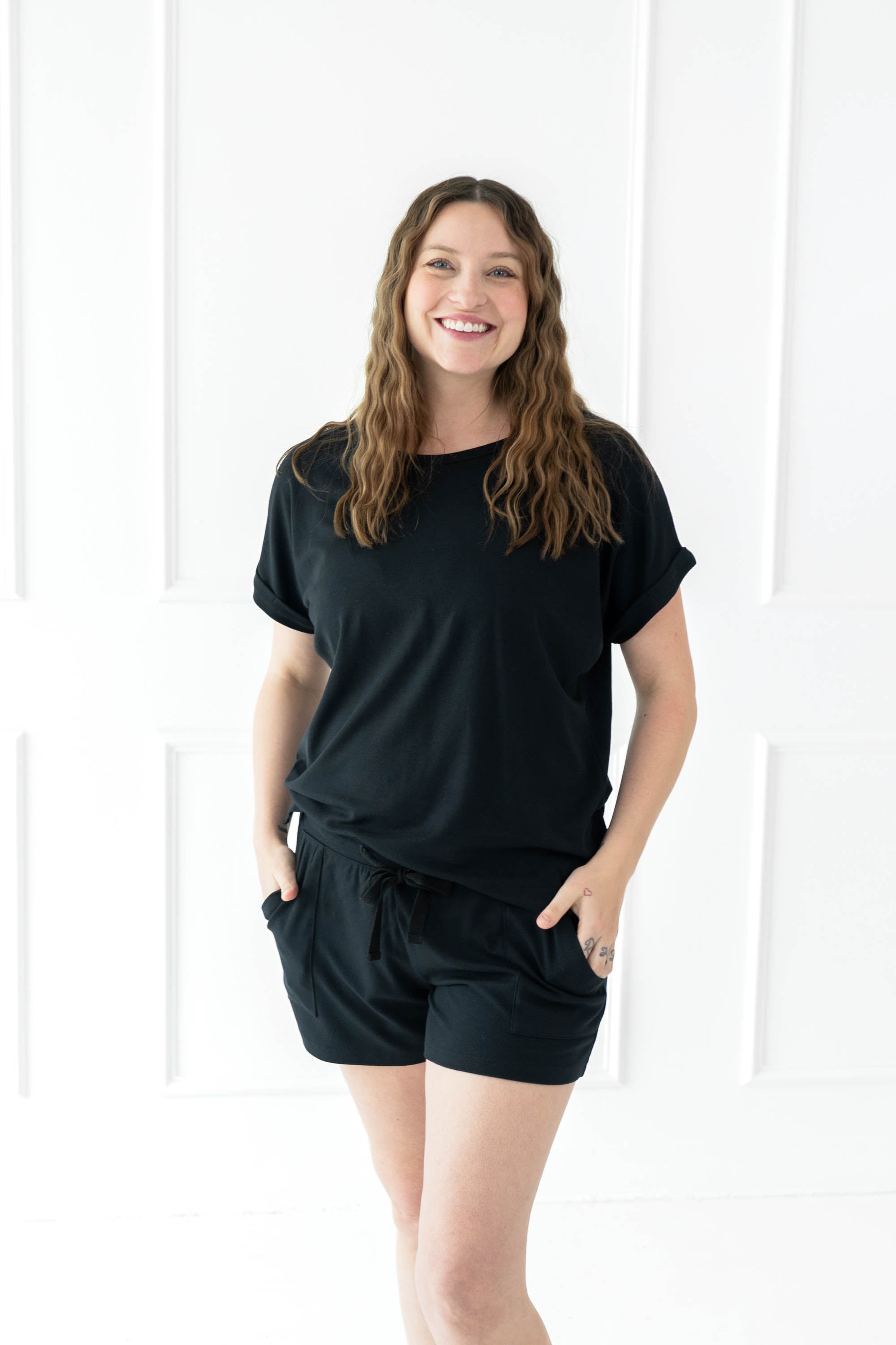 Female modeling the Women's Bamboo Jersey Rollup Sleeve Tee in Midnight paired with Midnight Bamboo Jersey Shorts 