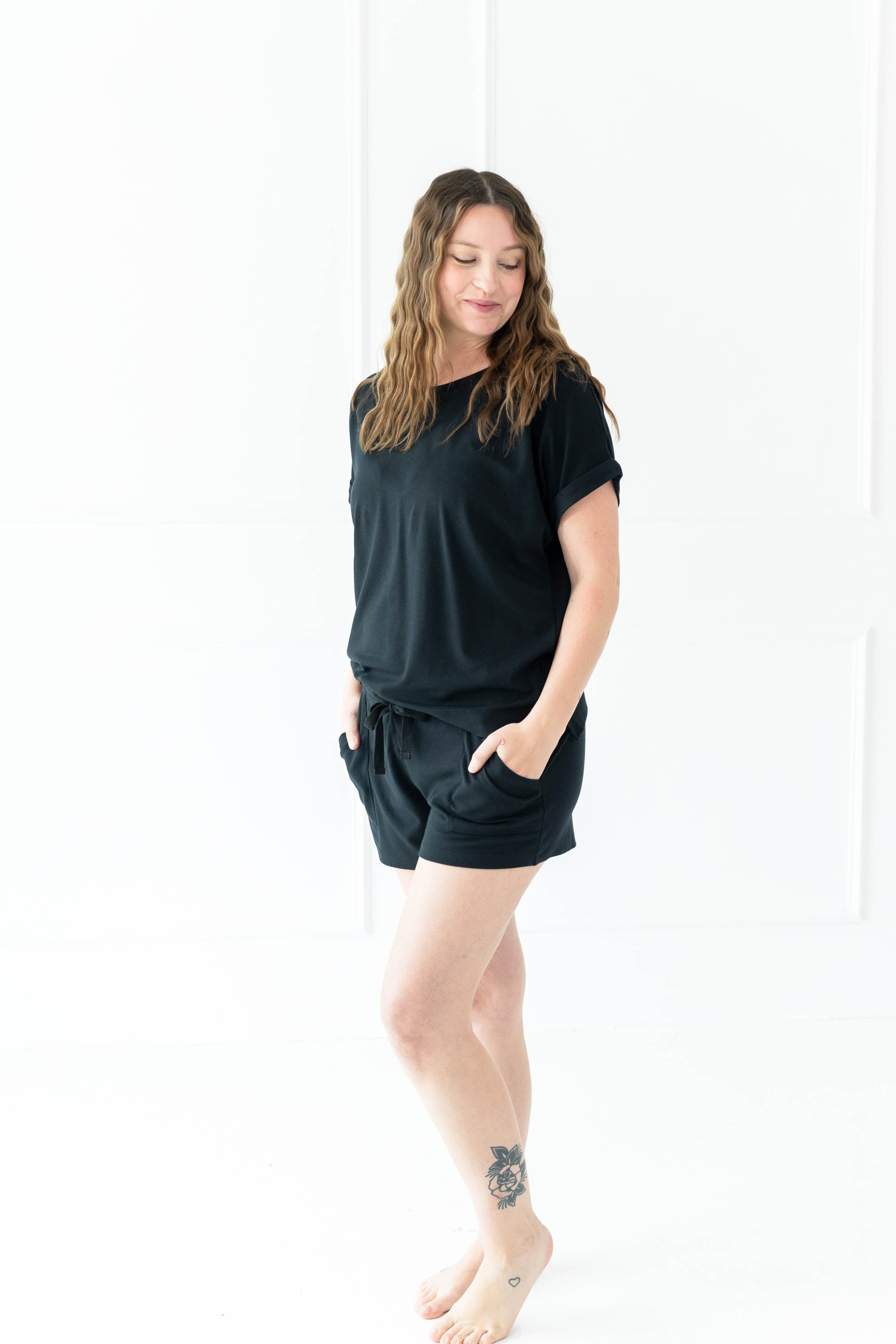 Model wearing the Women's Bamboo Jersey Rollup Sleeve Tee in Midnight and Midnight Bamboo Jersey Shorts