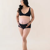 Woman modeling Women's High-Waisted Brief in Midnight with cross front bralette