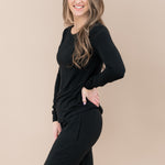 Model wearing Midnight Jogger Pajama set showing off the side of the set with pockets
