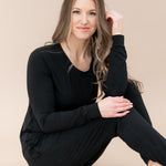 Sitting model wearing the Women's Jogger Pajama Set in Midnight