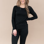 Smiling model wearing the Women's Jogger Pajama Set in Midnight