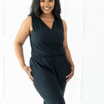 Smiling model wearing the Women's Jumpsuit in Midnight