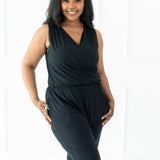 Smiling model wearing the Women's Jumpsuit in Midnight