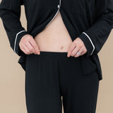 Close up of the elastic waistband on the Women's Long Sleeve Pajama Set in Midnight with Cloud Trim