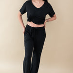 Model wearing Women's Lounge Pants in Midnight paired with a Midnight V-Neck