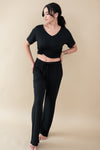 Model wearing Women's Lounge Pants in Midnight paired with a Midnight V-Neck