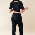 Female modeling the back of the Women's Lounge Pants in Midnight
