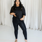 Female model wearing the Bamboo Flex Women’s Leggings in Midnight and matching short sleeve tee