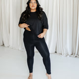 Female model wearing the Bamboo Flex Women’s Leggings in Midnight and matching short sleeve tee