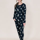 Smiling model wearing the Women's Jogger Set in Midnight Magnolia with hand in pocket
