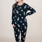 Woman looking to the side with hand on her hip while modeling the Women's Jogger Set in Midnight Magnolia
