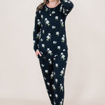 Model with hand in hair while wearing the Kyte  Women's Jogger Set in Midnight Magnolia