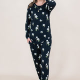 Model with hand in hair while wearing the Kyte  Women's Jogger Set in Midnight Magnolia