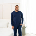 Man modeling Navy Lounge Pant and matching Henley Top