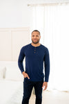 Man modeling Men's Long Sleeve Henley Top in Navy with jeans with hand in pocket