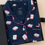 Long-Sleeved Women's Pajama Set in Navy Mahjong print packed in a box on a beige background