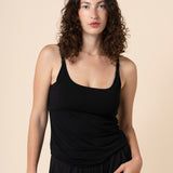 Brunette model wearing the Kyte Women's Nursing Tank in Midnight paired with matching bottoms 

::: Model is 5'11" wearing size M ///

