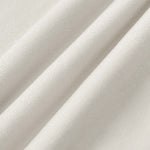 Close up image of oat color fabric