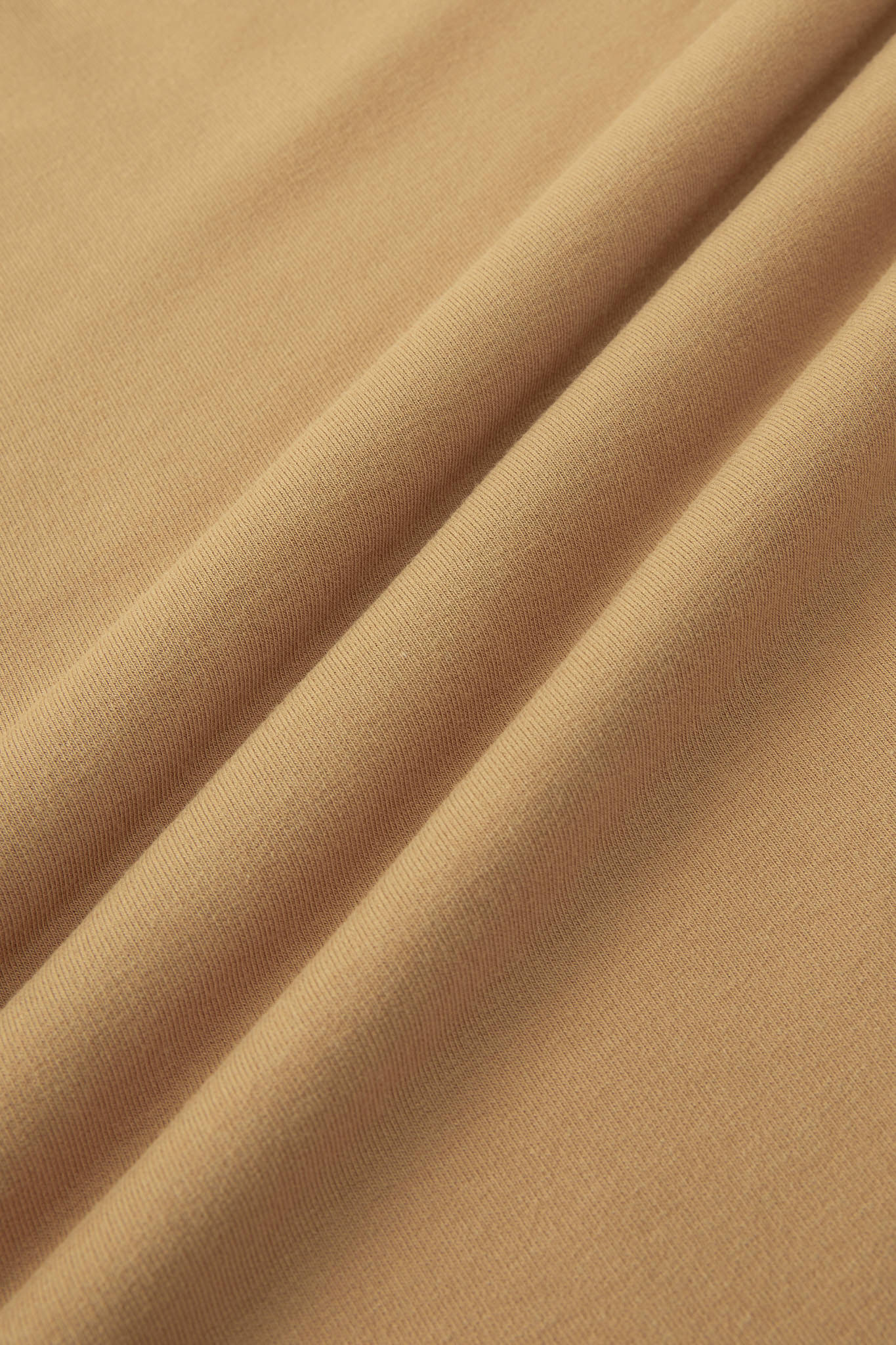 Close up image of Ochre color fabric