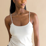 Woman wearing a biege tank top and black pants against a beige background ::: Model is 5'9" wearing size S ///