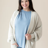 Woman modeling Chunky Knit Women's Oversized Cardigan in Oat and Slate Biker Short Set