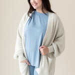 Woman modeling Chunky Knit Women's Oversized Cardigan in Oat and Slate Biker Short Set
