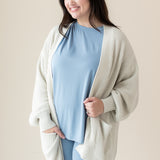 Woman modeling Chunky Knit Women's Oversized Cardigan in Oat and Slate Biker Short Set