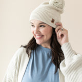Woman modeling Chunky Knit Pom Beanie in Oat side view
