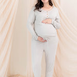 Expectant mother cradling her baby bump wearing the Women's Ribbed Jogger Pant in Oat