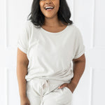 Model wearing the Women's Bamboo Jersey Rollup Sleeve Tee in Oat paired with Bamboo Jersey Shorts in Oat
