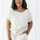 Model wearing the Women's Bamboo Jersey Rollup Sleeve Tee in Oat paired with Bamboo Jersey Shorts in Oat