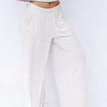 Women's Wide Leg Pant in Oat shown on a model in front of a white backdrop