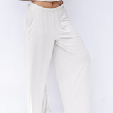 Women's Wide Leg Pant in Oat shown on a model in front of a white backdrop