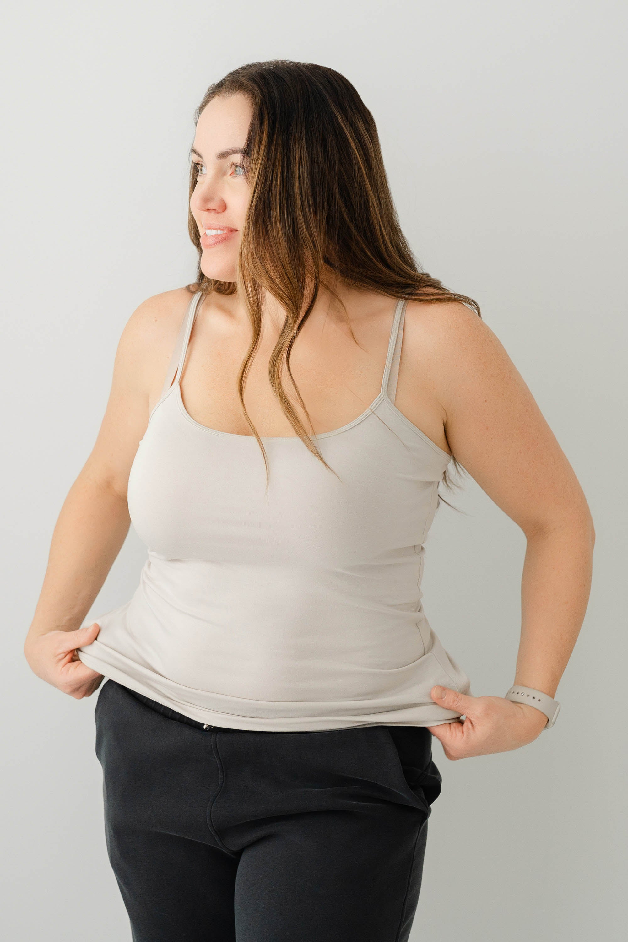 Model wearing the Women’s Camisole in Oat paired with Black pants