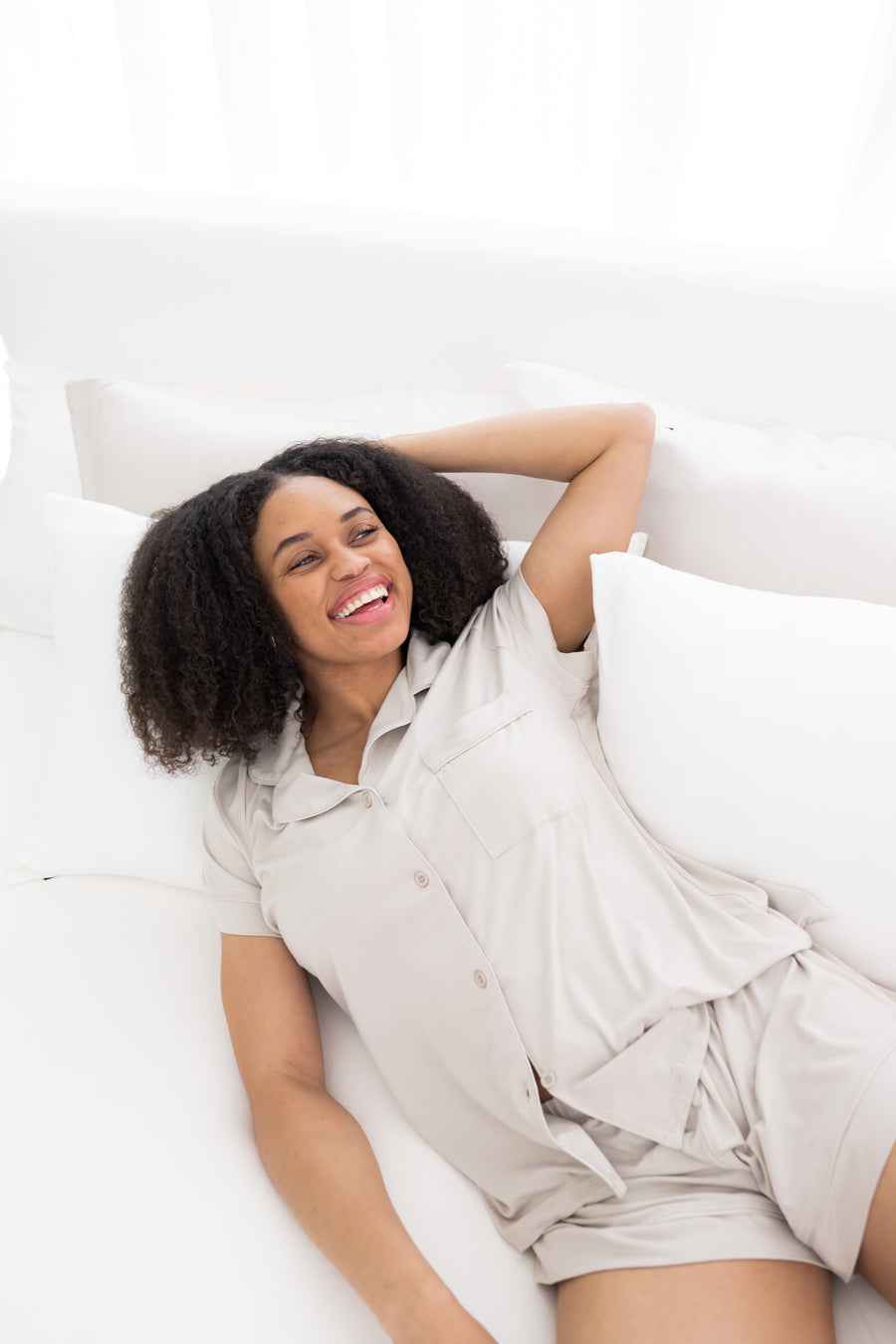 Model wearing Women's Short Sleeve Pajama Set with shorts in Oat